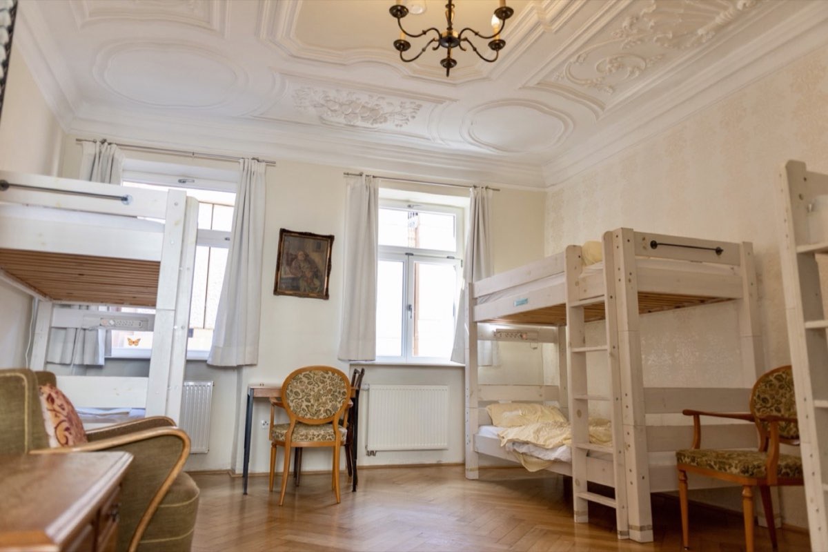 Shared room with white bunk beds and a stucco ceiling